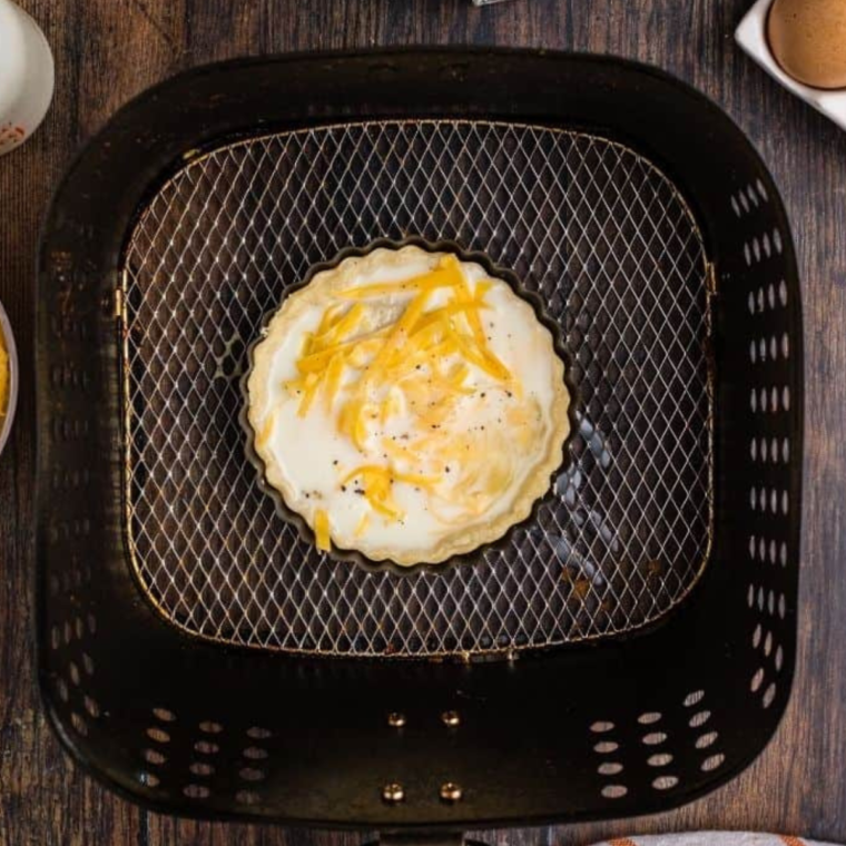 Placing quiche in the air fryer for cooking