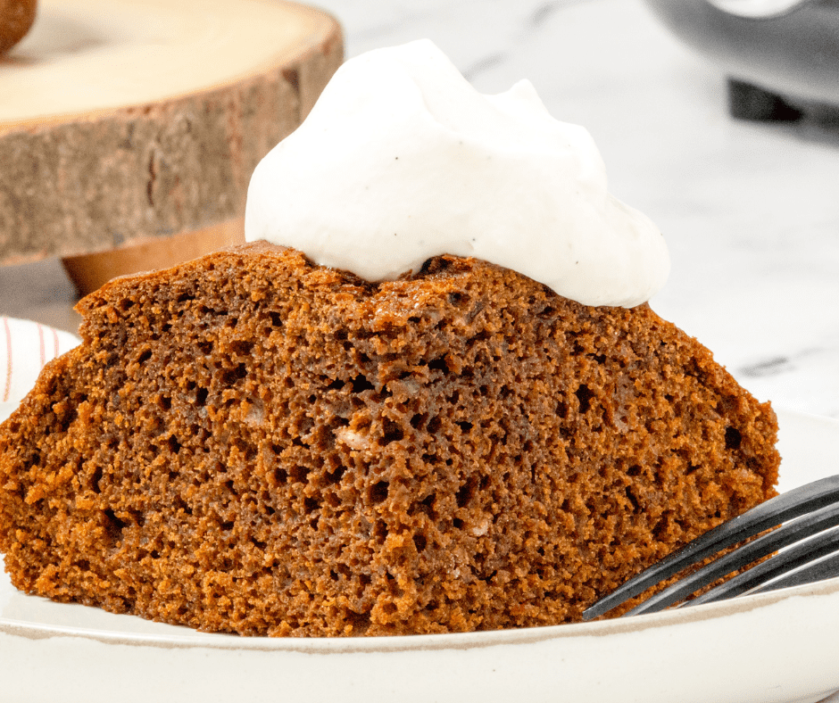Air fryer gingerbread cake baking in a pan, set to 320°F for a delicious, spiced dessert.