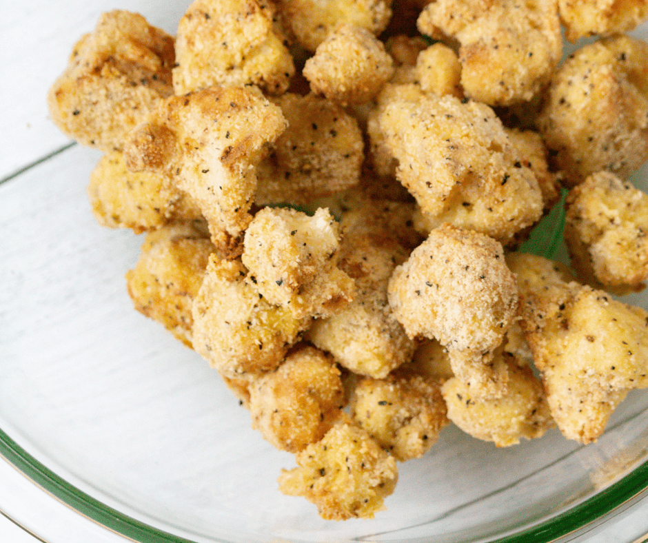 Golden crispy Air Fryer Bang Bang Cauliflower coated in a spicy and creamy sauce.