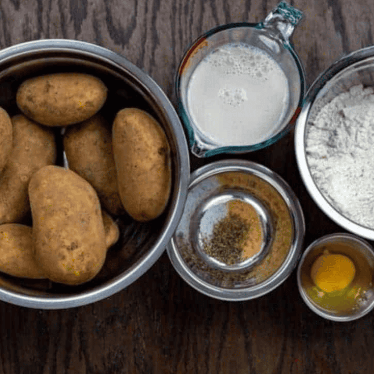 Ingredients needed for Air Fryer Copycat KFC Potato Wedges on kitchen table.