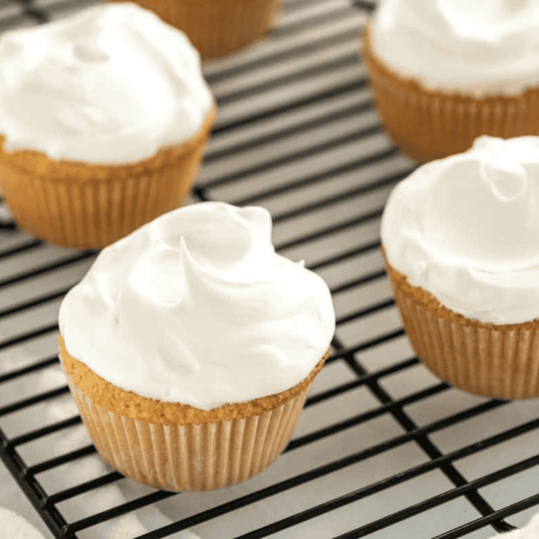 Smooth 3 ingredient cream cheese frosting without butter in a bowl ready for spreading on cupcakes