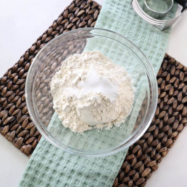 Add dry ingredients for McDonald's Biscuits on kitchen table. 