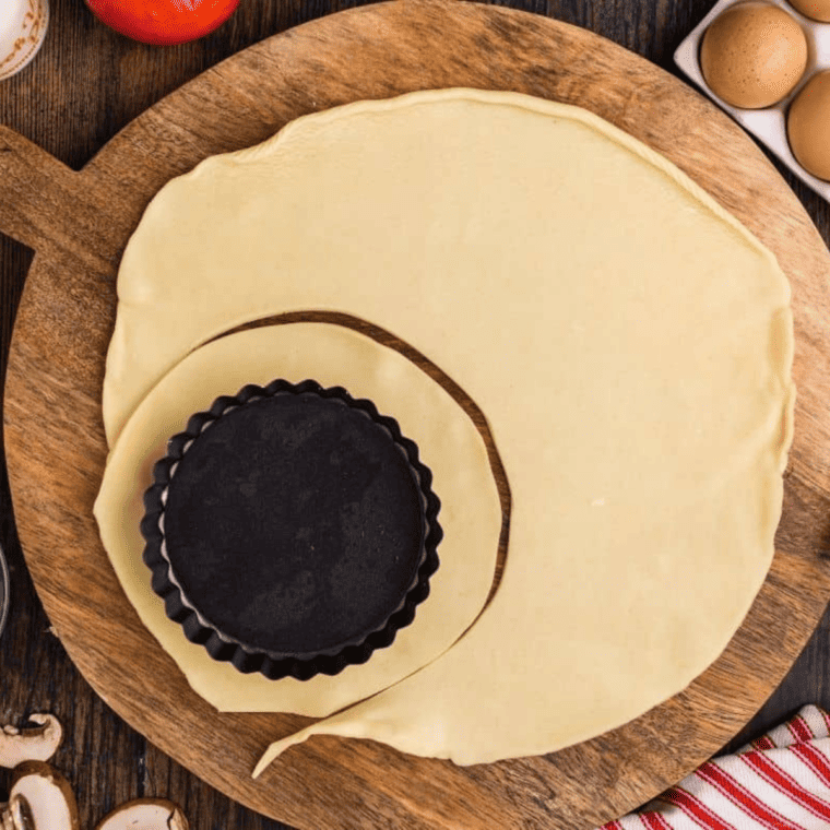 Start by cutting out the dough for the pastry pie crust.