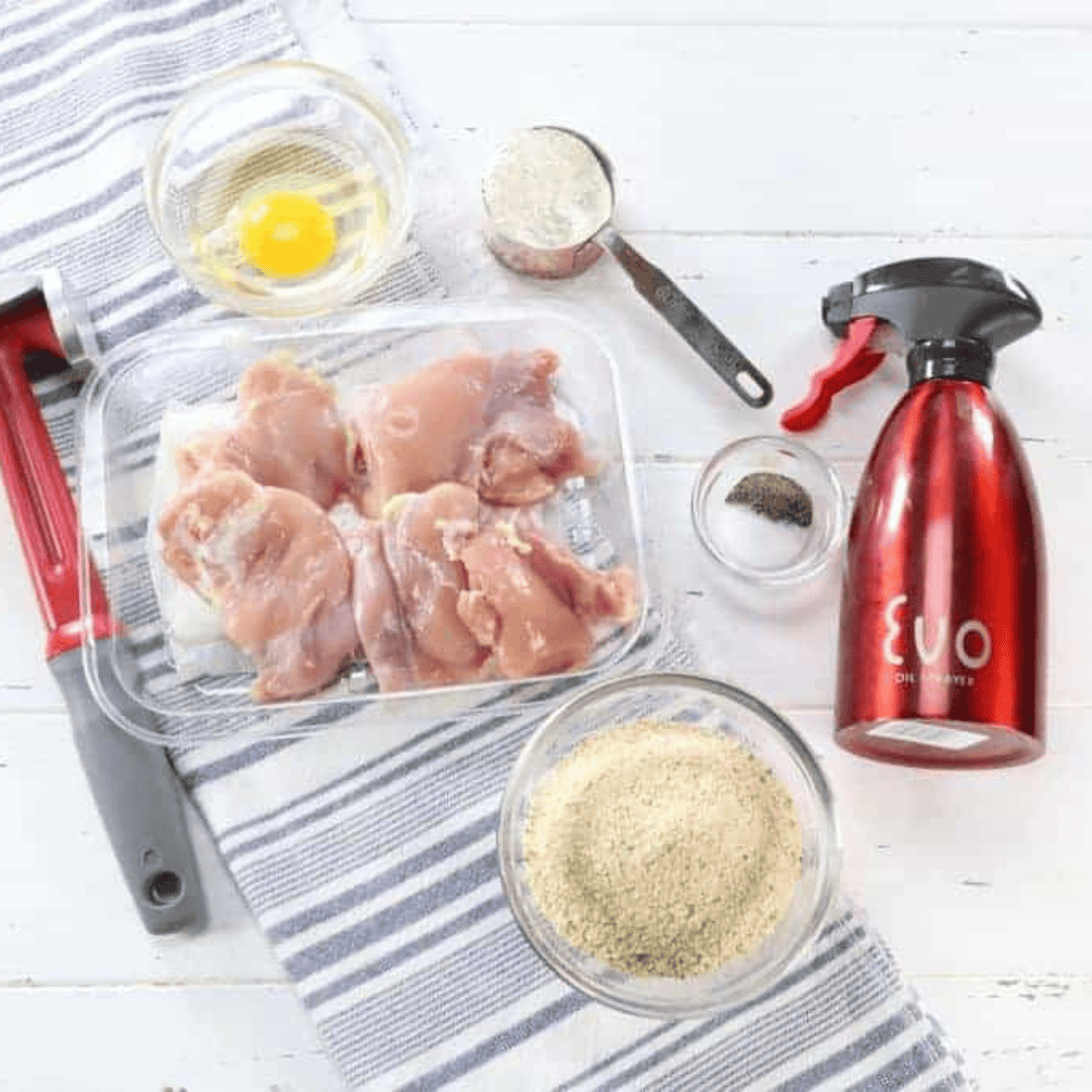 Ingredients for air fryer chicken thigh schnitzel including chicken thighs, breadcrumbs, flour, egg, salt, and pepper