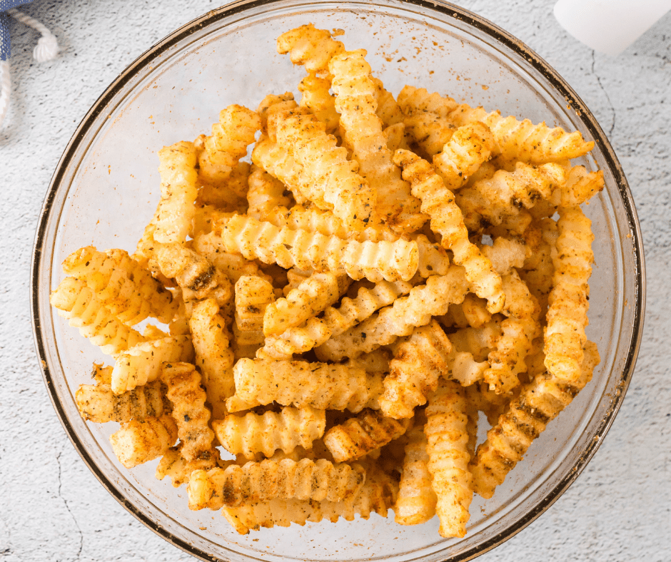 frozen crinkles fries coated in oil and seasoning