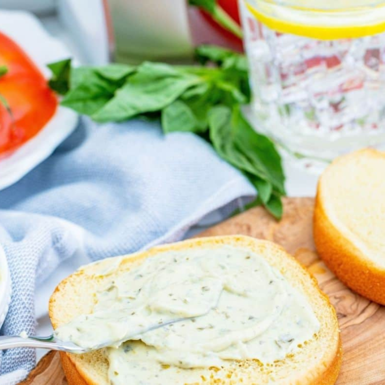 Assembling the Air Fryer Portobello Mushroom Burger with lettuce, tomato, and a toasted bun.