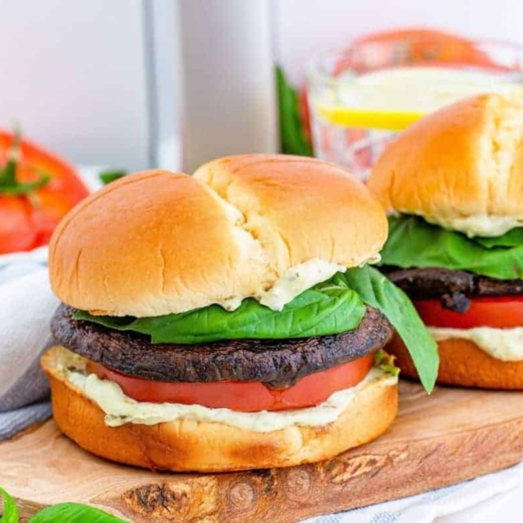 Completed Air Fryer Portobello Mushroom Burger, served on a plate with a side of fries.