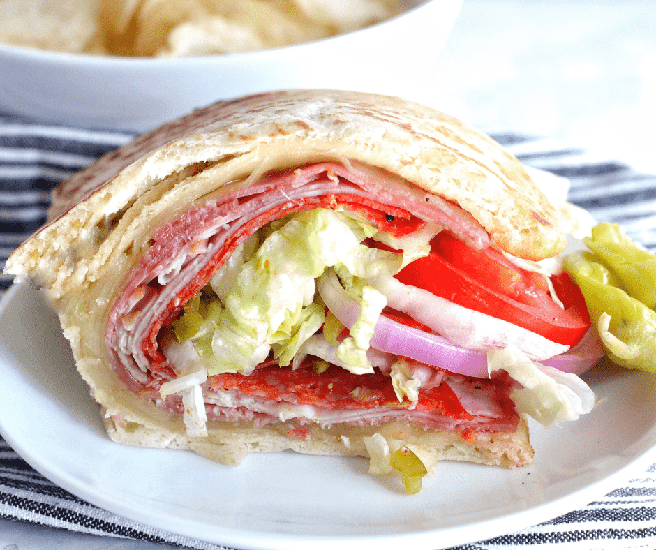 Crispy Air Fryer Flatbread Sandwich with melted cheese, deli meats, and fresh vegetables