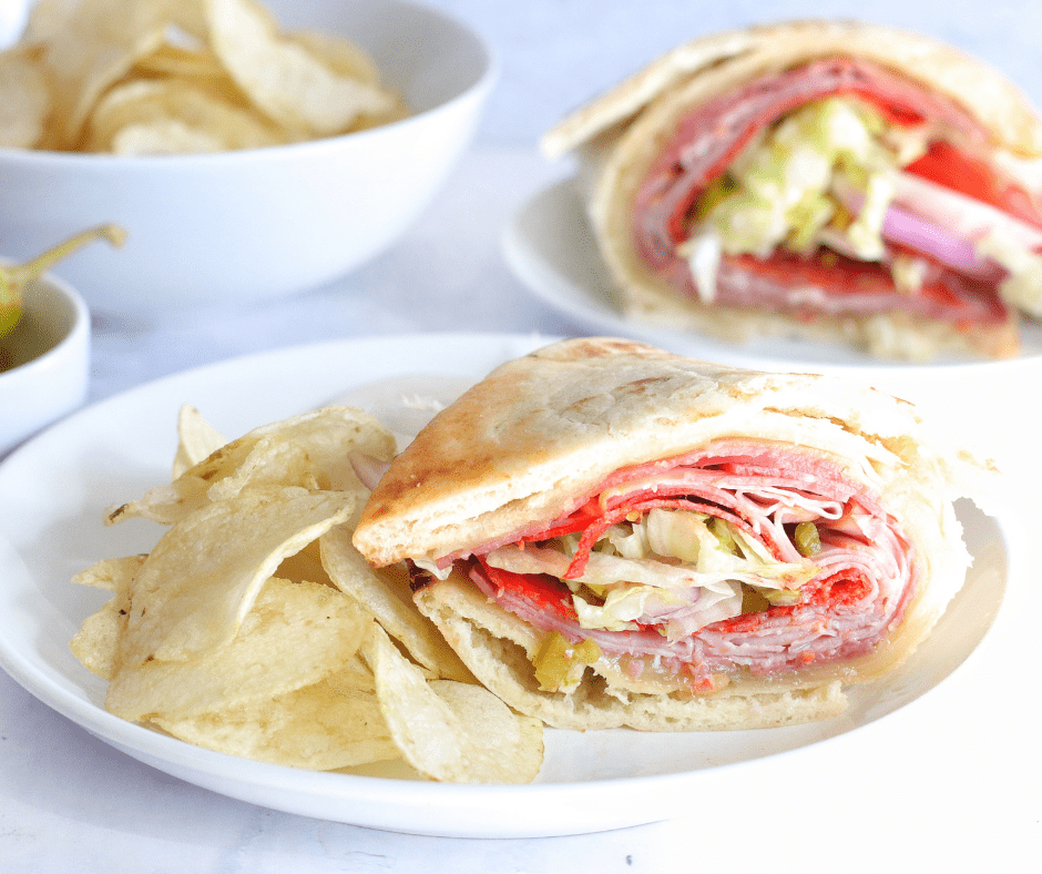 Air Fryer Flatbread Sandwich with cheese, salami, ham, pepperoni, and pepperoncini, cooked until golden and crispy.
