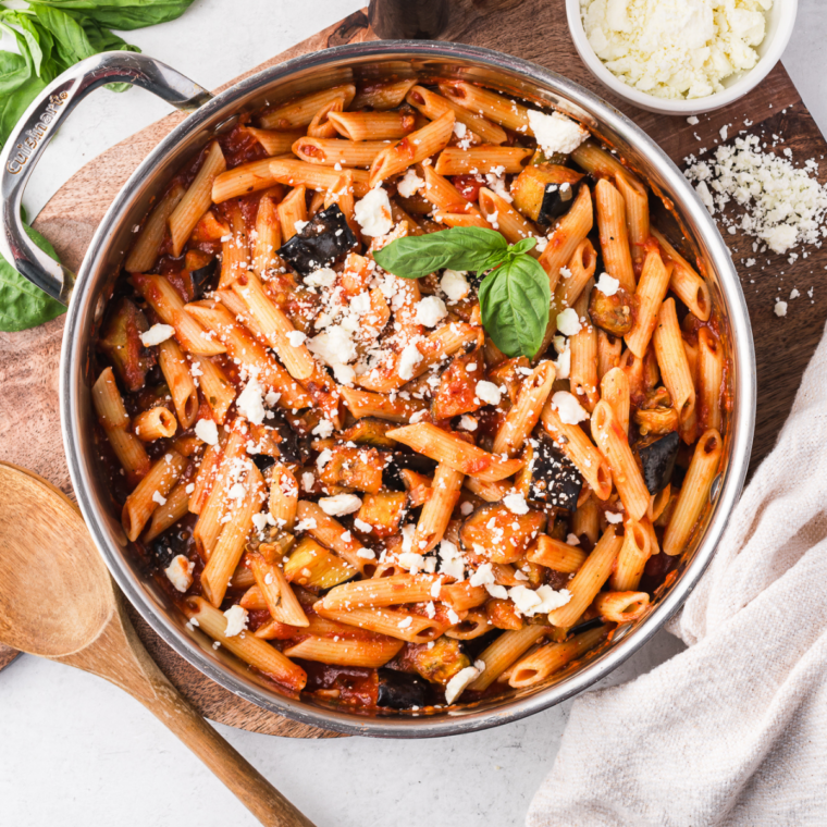 Bowl of homemade Copycat Cheesecake Factory marinara sauce garnished with fresh herbs.