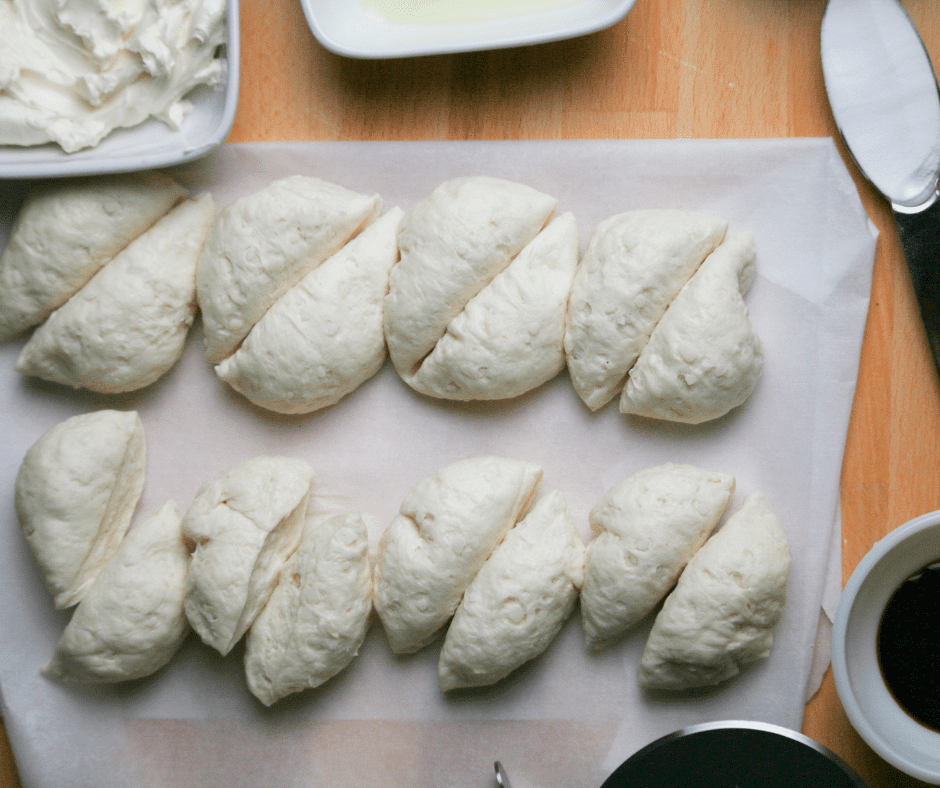 Divide the frozen dough into half, on a cutting board.