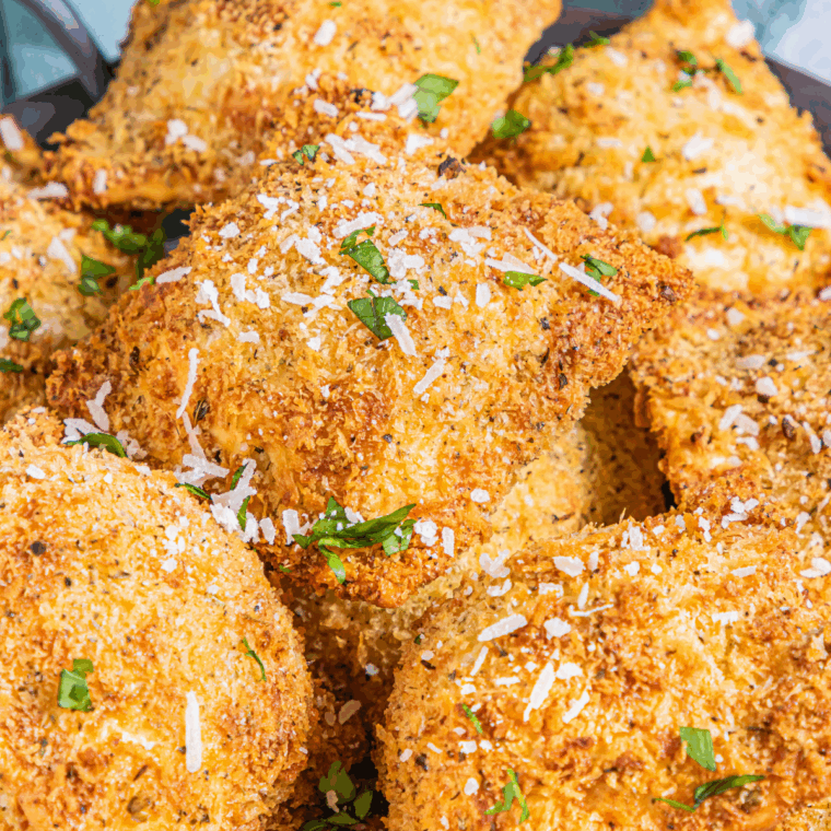 Crispy golden breaded ravioli cooked in the air fryer, served with dipping sauce