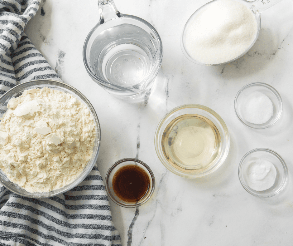 Ingredients needed for Air Fryer Vanilla Cake on kitchen table.