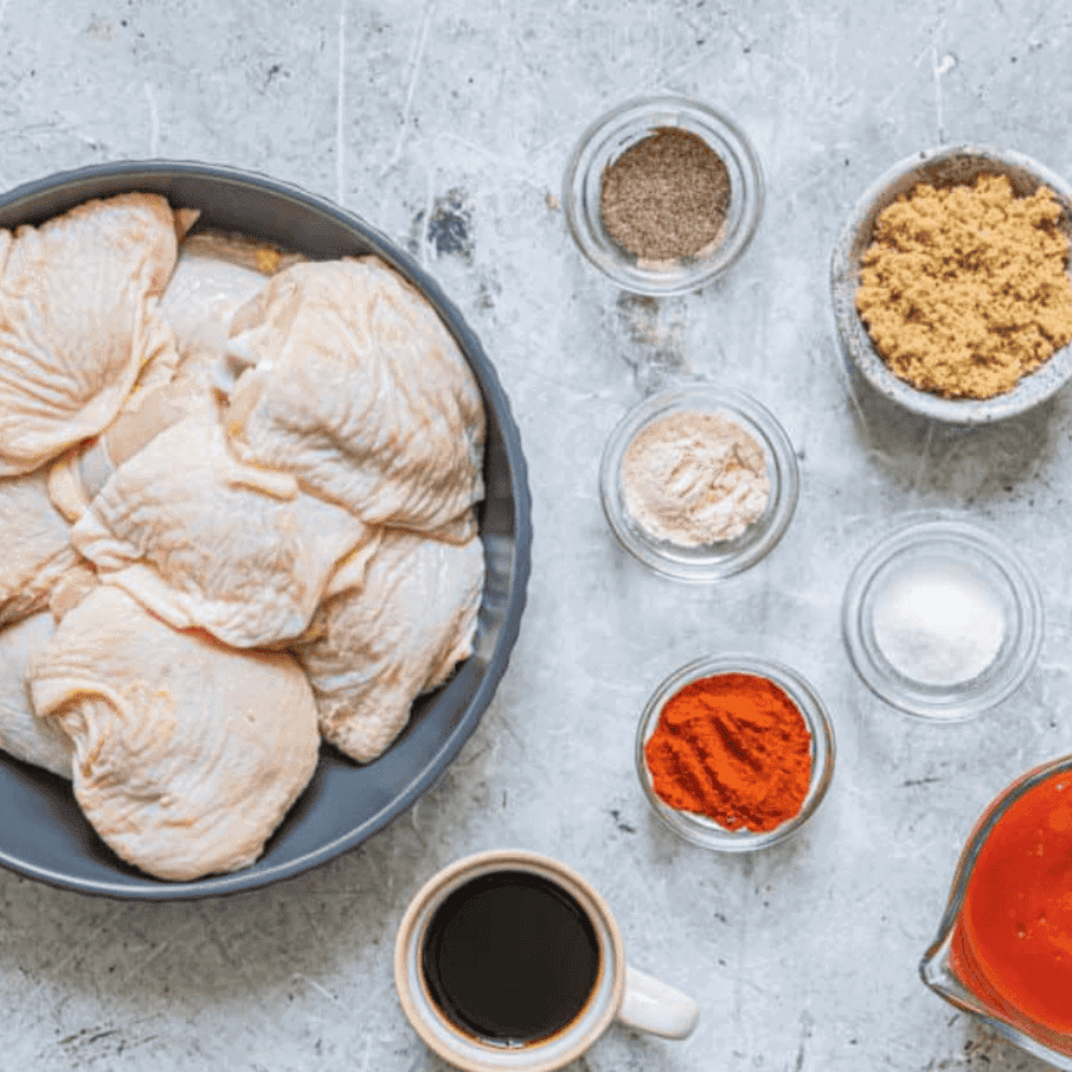 Ingredients needed for Wingstop Buffalo Chicken Thighs Recipe on kitchen table.