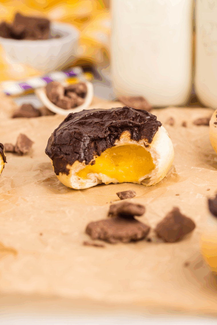 Air fryer Bavarian cream donuts filled with vanilla custard and topped with melted chocolate
