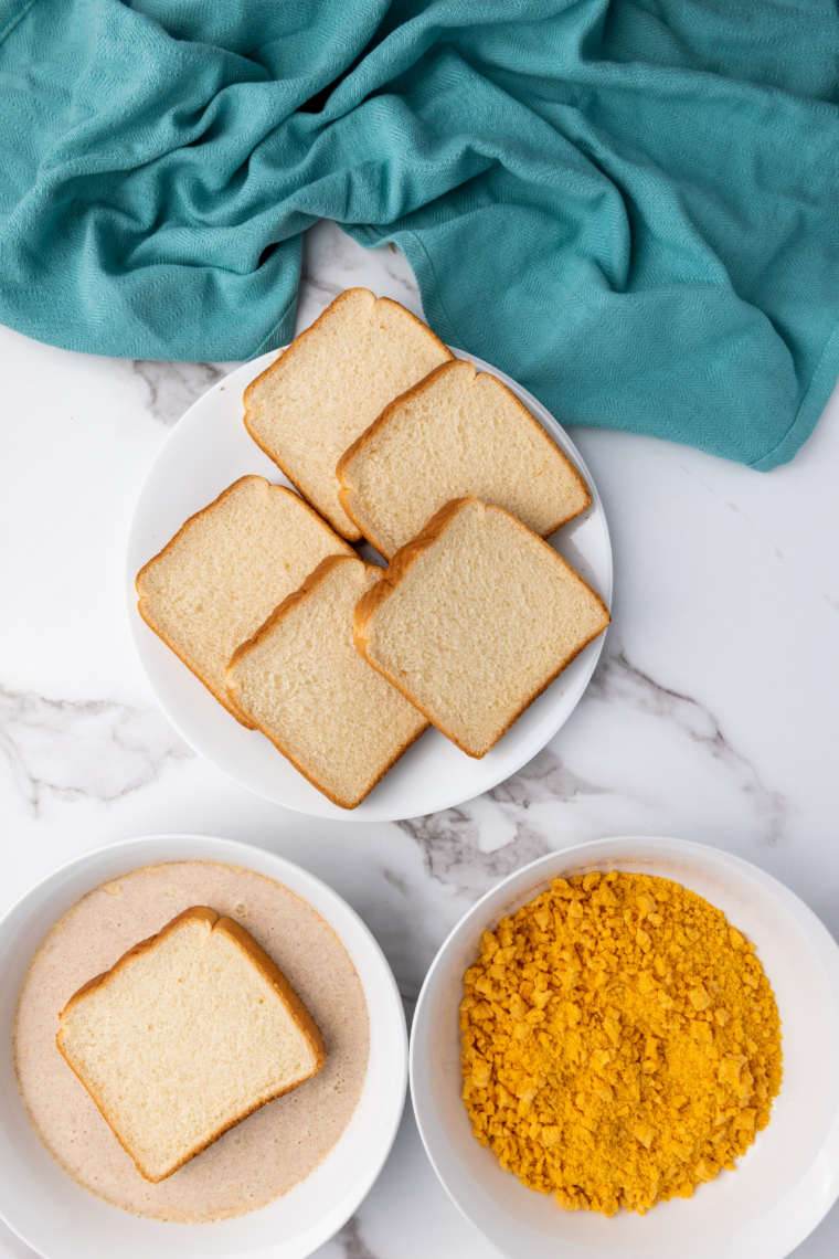 Coat the Bread: Texas Toast dipped in egg mixture and pressed into crunchy Cap’n Crunch coating.
