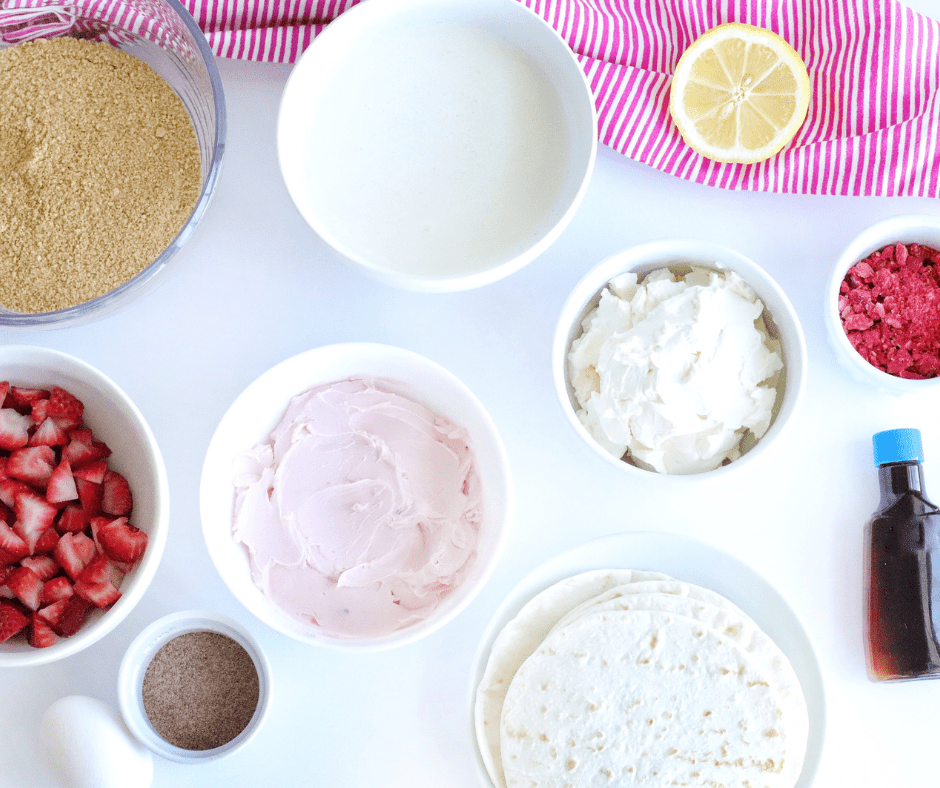 Ingredients for air fryer cheesecake strawberry tacos laid out on a kitchen counter