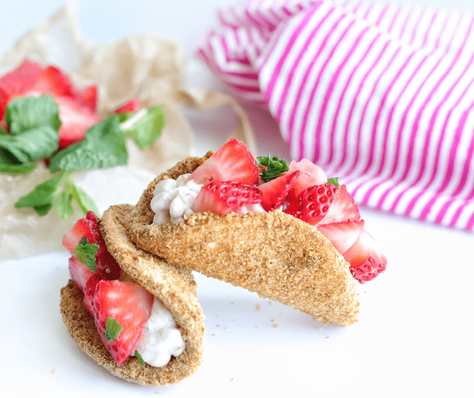 Air Fryer Cheesecake Strawberry Tacos with crispy graham shells, creamy filling, and fresh strawberries