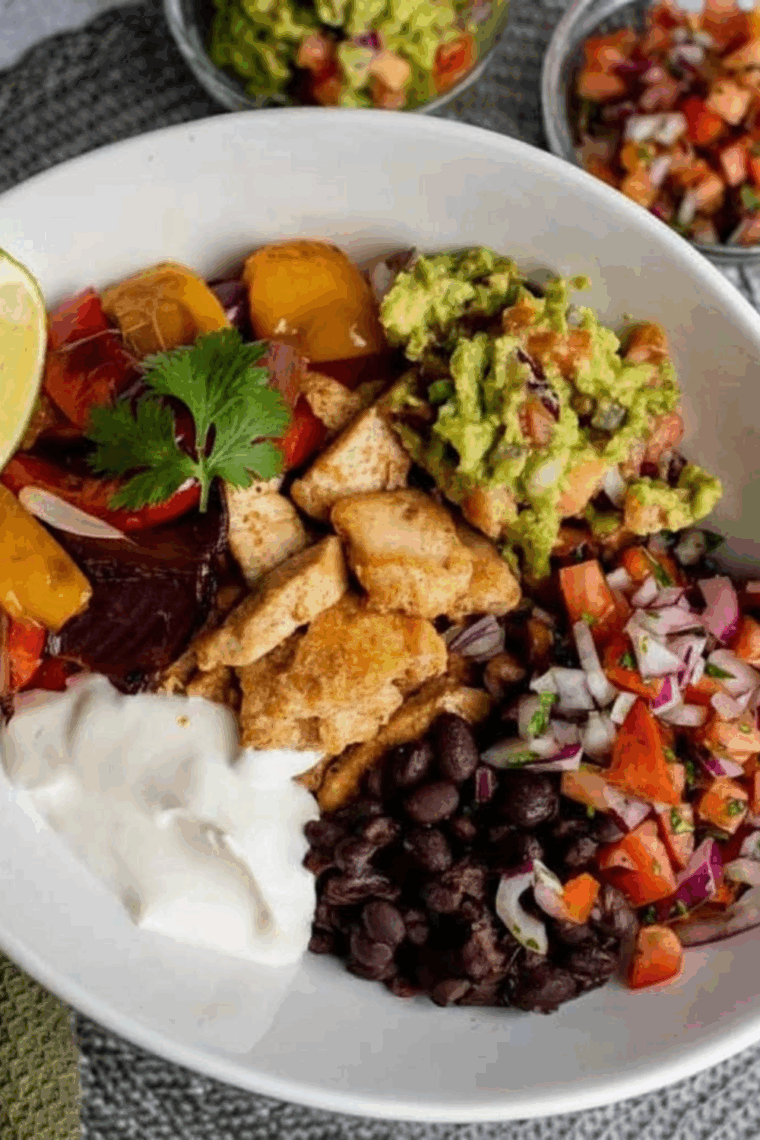 Air Fryer Chicken Fajita Rice Bowl with seasoned chicken, bell peppers, onions, and rice in a bowl