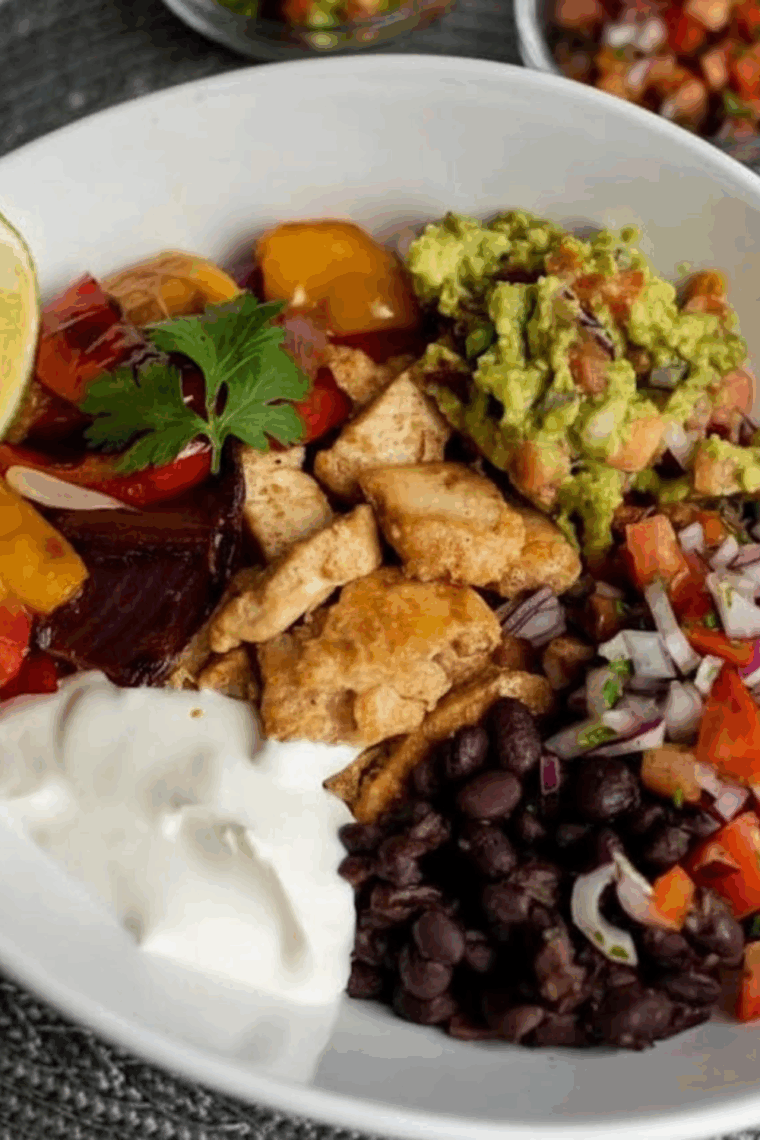 Air Fryer Chicken Fajita Rice Bowl with seasoned chicken, bell peppers, onions, and rice in a bowl