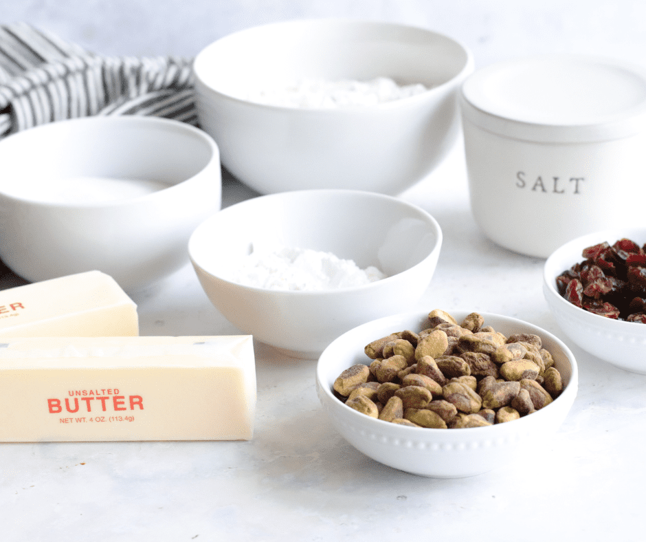 Ingredients needed for Air Fryer Cranberry Pistachio Shortbread Cookies on kitchen table.
