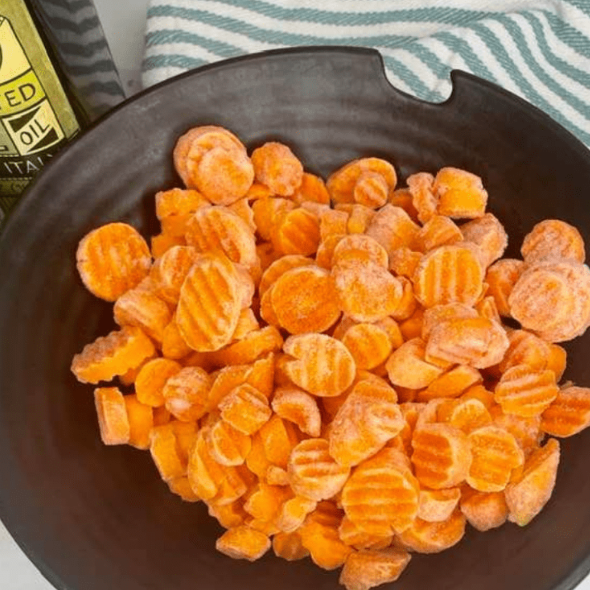 Step-by-step process of making Air Fryer Frozen Carrots.