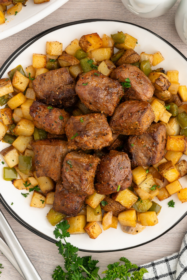 Garlic butter steak bites and potatoes on a plate