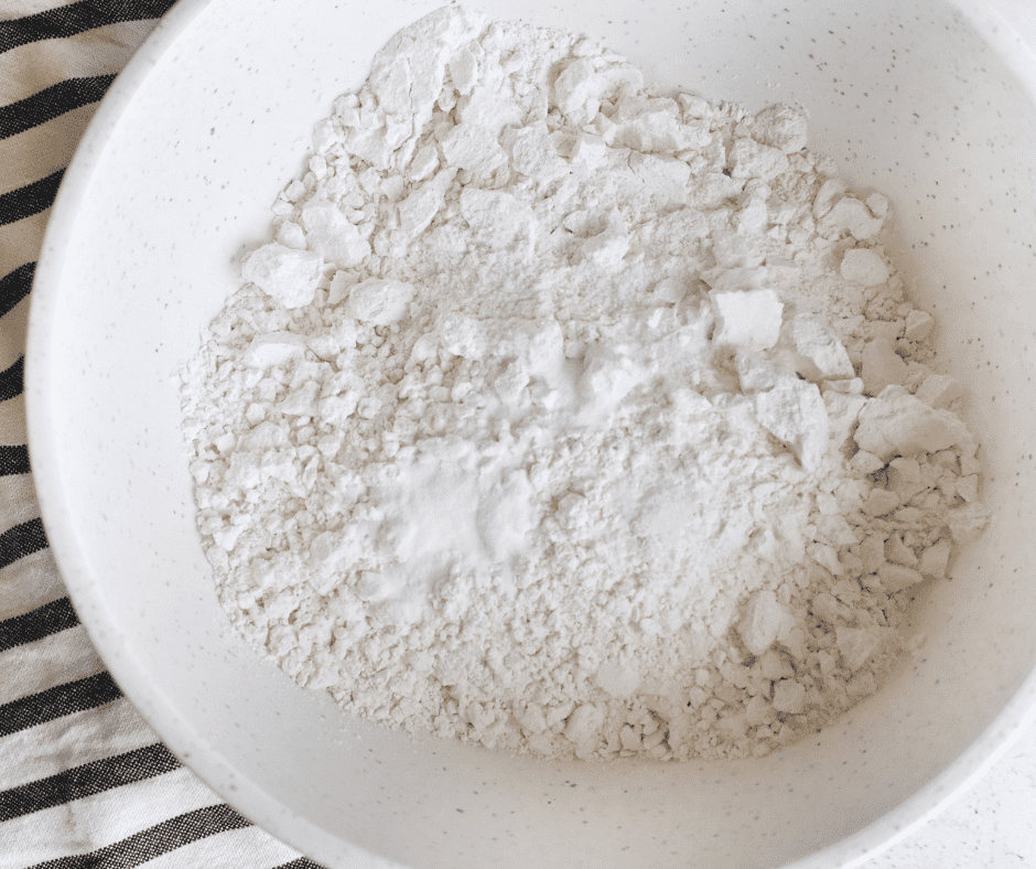 Flour, baking soda, and salt mixed together in a large bowl.