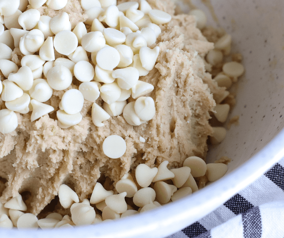 Lemon extract, vanilla, and eggs mixed in, then flour and white chocolate chips folded into cookie dough.