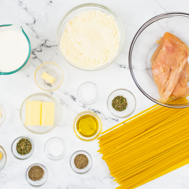 Ingredients needed for Applebee’s Chicken Fettuccine Alfredo Copycat Recipe on kitchen table.