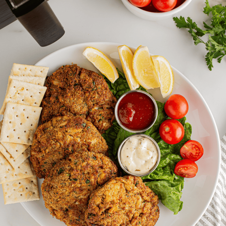 Close-up of crispy air fryer crab cakes fresh from the basket