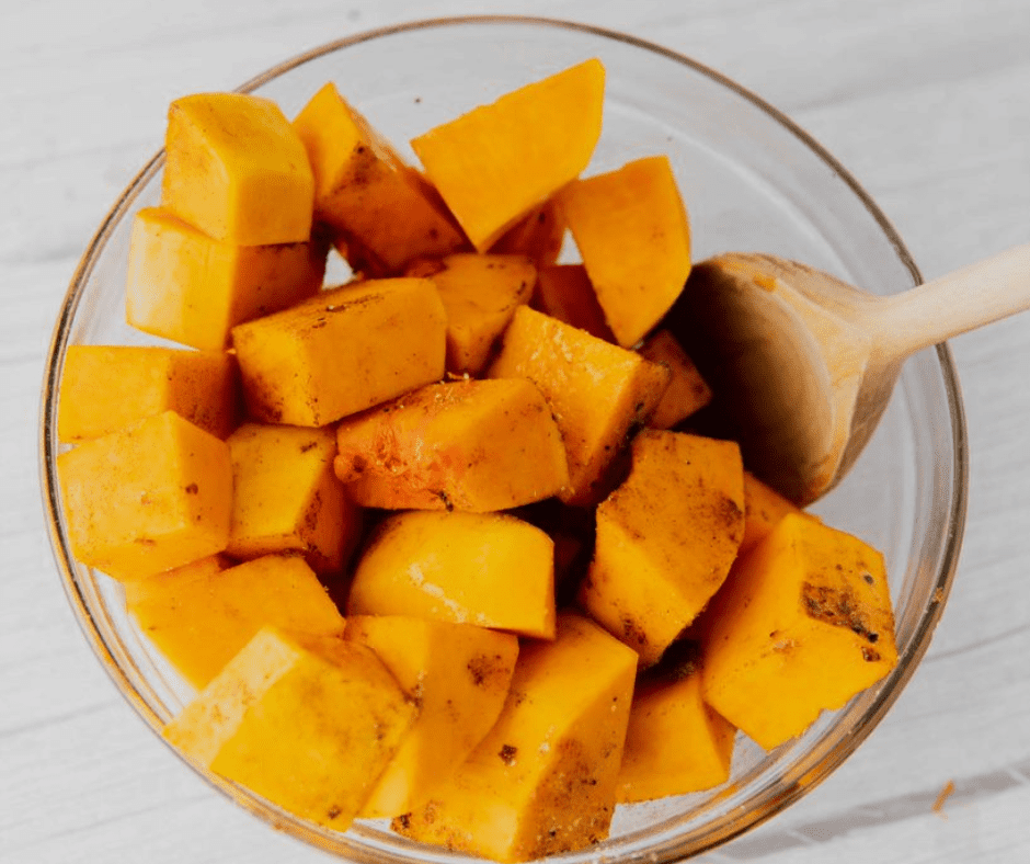 Coat diced sweet potatoes with oil, lime juice, and spices in a large bowl.