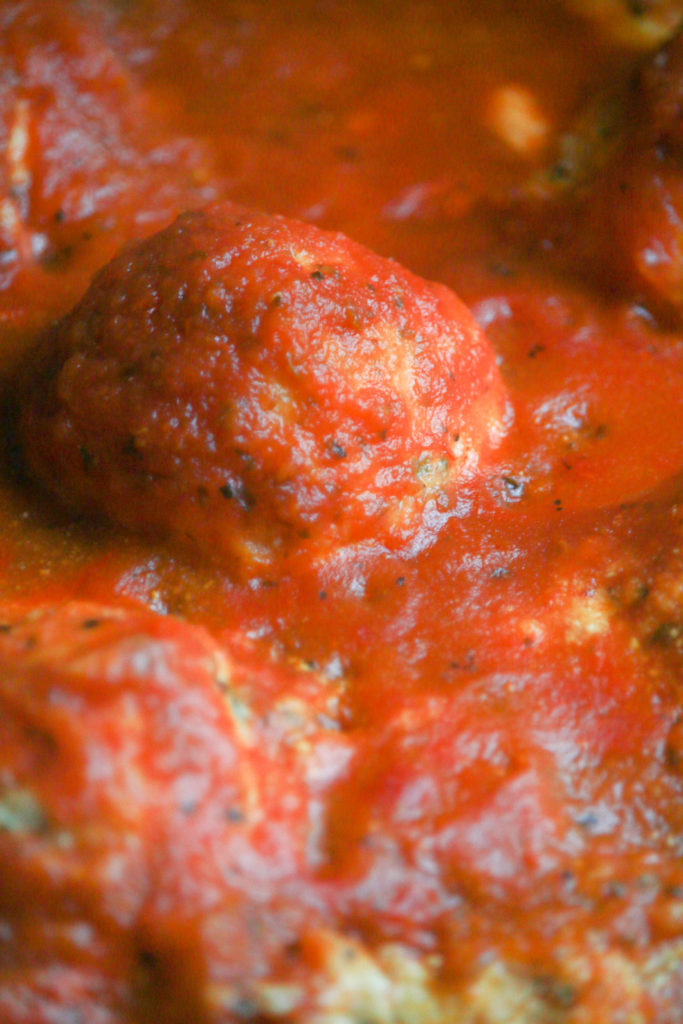 Air Fryer Ricotta Meatballs served with sauce on a plate