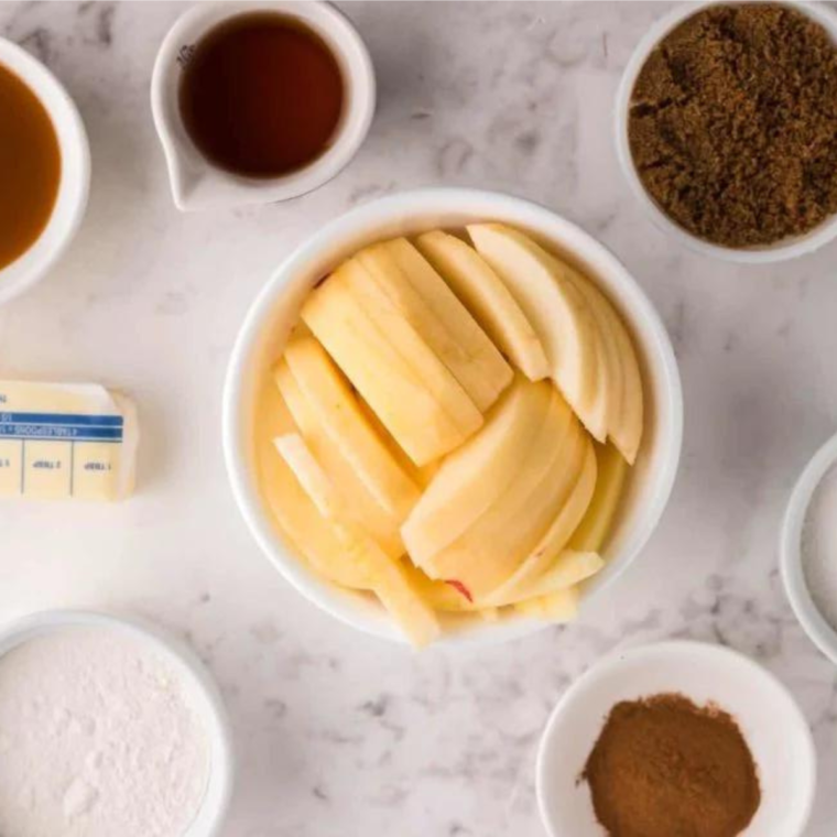 Ingredients for air fryer amaretto apple crumble: apples, amaretto, oats, almonds, and butter