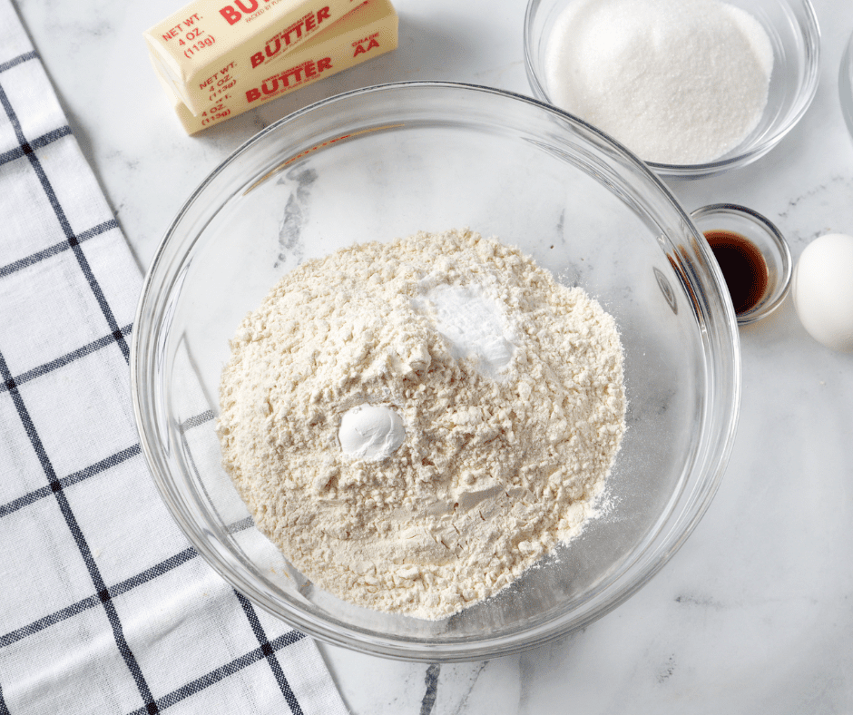 Dry ingredients for Apple Pie Spice Drop Cookies mixed together in a large bowl, including flour and warm spices