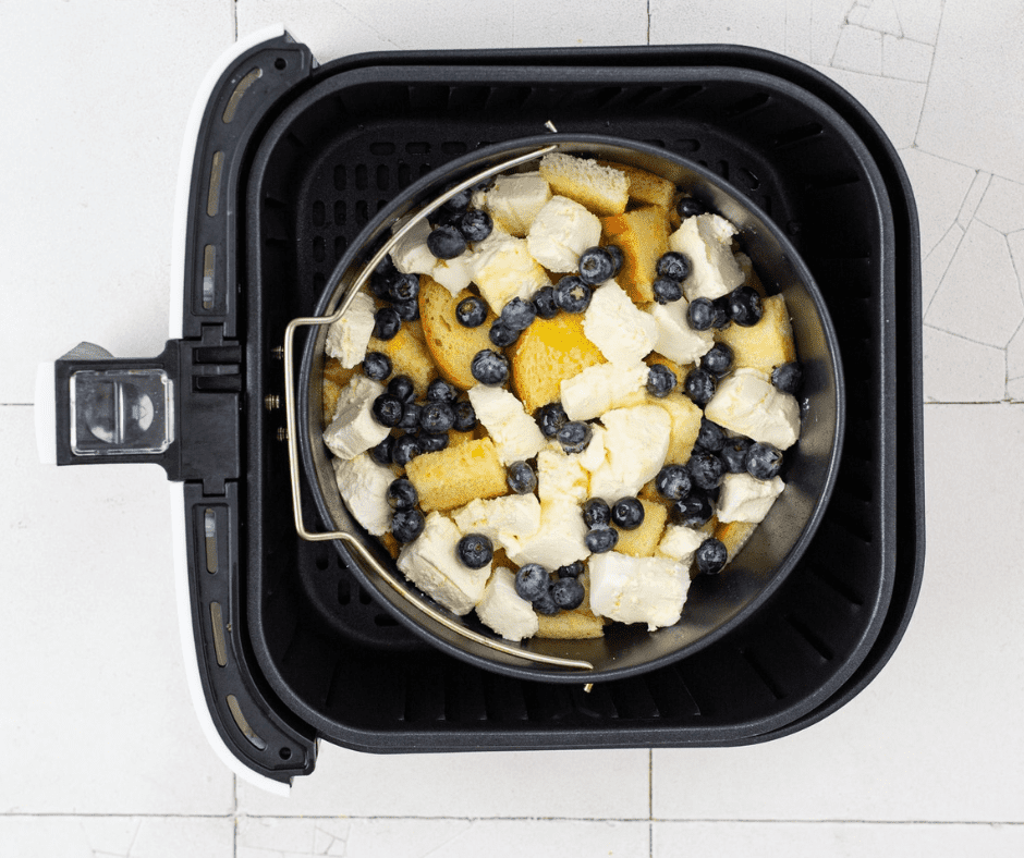 Baking pan placed in air fryer, cooking at 320°F until golden brown