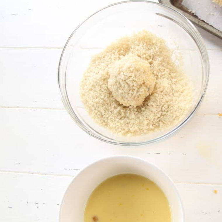 Batter the mac and cheese balls.