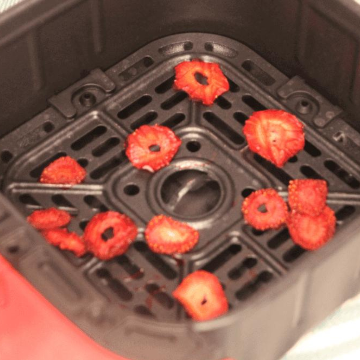 Dehydrated strawberries served on top of granola, perfect for a healthy snack or breakfast.