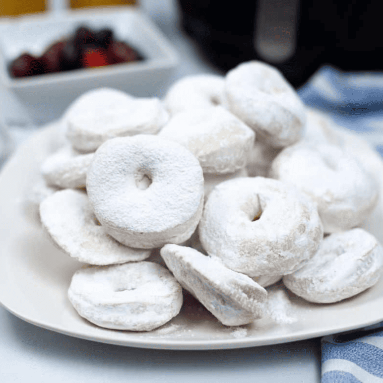 "Freshly made Copycat Hostess Powdered Donettes dusted with powdered sugar"