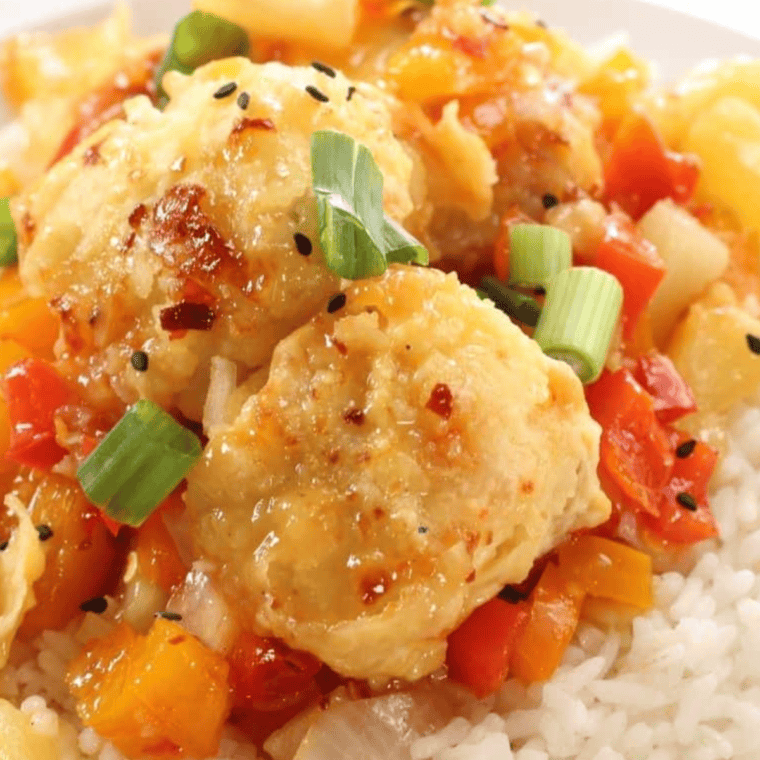 Air Fryer Panda Express Sweet Fire Chicken Copycat served on a plate with peppers and pineapple