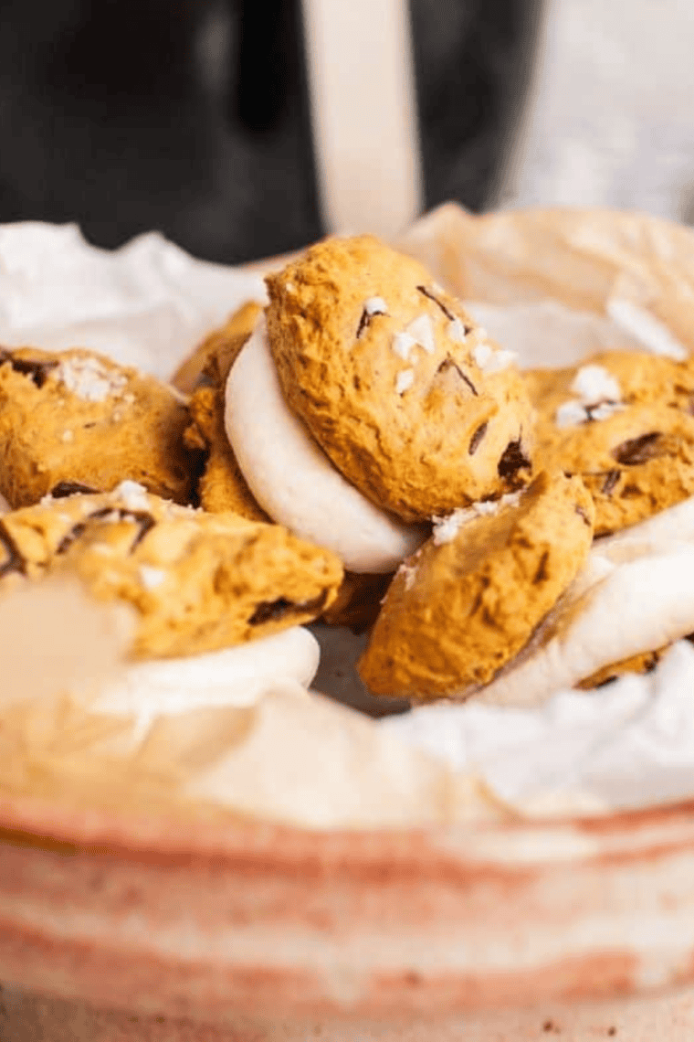 Soft, golden-brown pumpkin cake mix cookies fresh from the air fryer, perfect for fall treats.