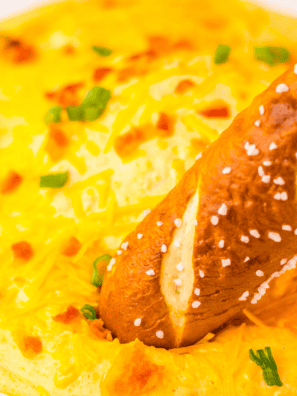 If you've ever hosted a game day or holiday get-together, you already know the truth—nobody remembers the main course, but they never forget the dip. I am absolutely obsessed with building an appetizer spread that stops people mid-conversation and has them asking for the recipe before they've even finished their first scoop. These are my tried-and-true crowd-pleasers: the ones I bring to every party and always, always come home with an empty dish. From the fiery, creamy kick of my Nashville Hot Chicken Dip to the hands-off magic of a slow cooker beer cheese, I've leaned hard into my air fryer and crockpot so I can actually enjoy the party instead of being glued to the stove. Whether you're loading up a chip, dunking a pretzel, or piling onto a cracker, every single one of these recipes is built to disappear fast. Grab your dippers and let's get this party started! 1. Easy Nashville Hot Chicken Dip Easy Nashville Hot Chicken Dip If you love the fiery kick of Nashville hot chicken, this dip is about to become your party obsession. Cream cheese and buttermilk mellow out the bold cayenne heat just enough to keep everyone coming back for one more scoop. It's creamy, spicy, and loaded with flavor—basically everything you want in a crowd-pleasing appetizer. View Recipe → 2. Air Fryer Cheddar Ranch Pickle Chips Air Fryer Cheddar Ranch Pickle Chips Crispy, cheesy, and full of flavor, these are the ultimate low-carb snack that totally steals the show at any gathering. Tangy pickles get coated in a zesty ranch-seasoned cheddar crust, then air-fried to golden perfection in minutes. They are completely addictive—don't say I didn't warn you! View Recipe → 3. Easy Slow Cooker Beer Cheese Dip Easy Slow Cooker Beer Cheese Dip Rich, creamy, and packed with bold cheesy flavor—all made completely hands-off in the crockpot. Just toss everything in, let it melt into something magical, and set it out with soft pretzels or crusty bread. It stays warm and perfectly dippable for hours with almost zero effort on your part. View Recipe → 4. Air Fryer Artichoke Dip Air Fryer Artichoke Dip This creamy, flavorful dip comes together so quickly in the air fryer, and it gets the most beautiful golden-brown top while staying luxuriously smooth underneath. Made with tender artichokes, cream cheese, and a perfect blend of spices, it's a classic appetizer that always has everyone coming back for seconds. Once you try it in the air fryer, you'll never go back to the oven! View Recipe → 5. Buffalo Ranch Dressing Buffalo Ranch Dressing Why choose between cool ranch and bold buffalo heat when you can have both in one incredible sauce? This zesty, creamy dressing is a total game-changer for wings, veggies, fries, and everything in between. It's so much better than anything from a bottle—once you make it homemade, there's no going back. View Recipe → 6. Easy Slow Cooker Jalapeño Popper Dip Easy Slow Cooker Jalapeño Popper Dip This dip brings all the heat and creaminess of a classic jalapeño popper without any of the fuss. Just toss everything into the crockpot, let it melt into cheesy, spicy magic, and watch it disappear faster than you can say 'just one more bite.' It's my go-to when I want big, bold flavors with zero babysitting. View Recipe → 7. Air Fryer Taco Bites Air Fryer Taco Bites Crispy, cheesy, and packed with seasoned taco meat in every single bite—these little flavor bombs are one of my favorite ways to feed a hungry game-day crowd. Quick and easy to make in the air fryer, they come out perfectly golden every time. Dunk them in salsa or guacamole and just try to eat only one. View Recipe → 8. Cream Cheese Spread with Warm Cherry Sauce Cream Cheese Spread with Warm Cherry Sauce This simple yet elegant appetizer tastes like dessert, and it could not be easier to pull together. Smooth, creamy cheese topped with a warm, sweet-tart cherry sauce creates the most amazing flavor contrast that feels totally fancy without any real effort. It's my secret weapon for holiday entertaining and last-minute guests. View Recipe → 9. Homemade French Onion Dip Homemade French Onion Dip This is one of America's all-time favorite dips, and the homemade version is on a completely different level from anything in a store-bought tub. It's rich, savory, and so easy to throw together—perfect for impromptu gatherings or late-night chip dipping straight from the fridge. Once you go homemade, you'll never look back! View Recipe →