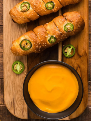 Applebee's Brew Pub Pretzels and beer cheese dip served on a wooden board