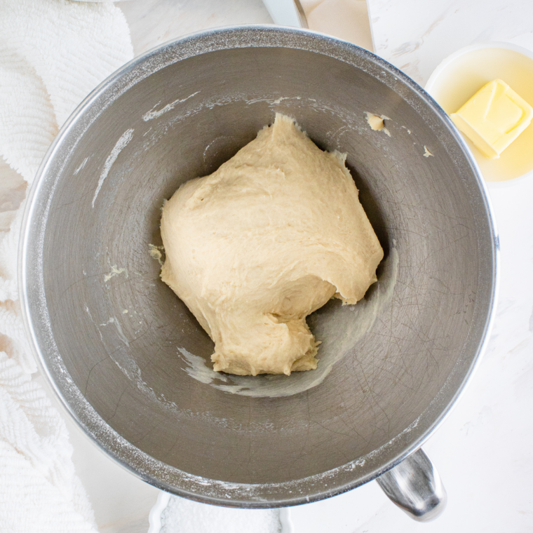 Soft pretzel dough kneaded smooth in a mixing bowl