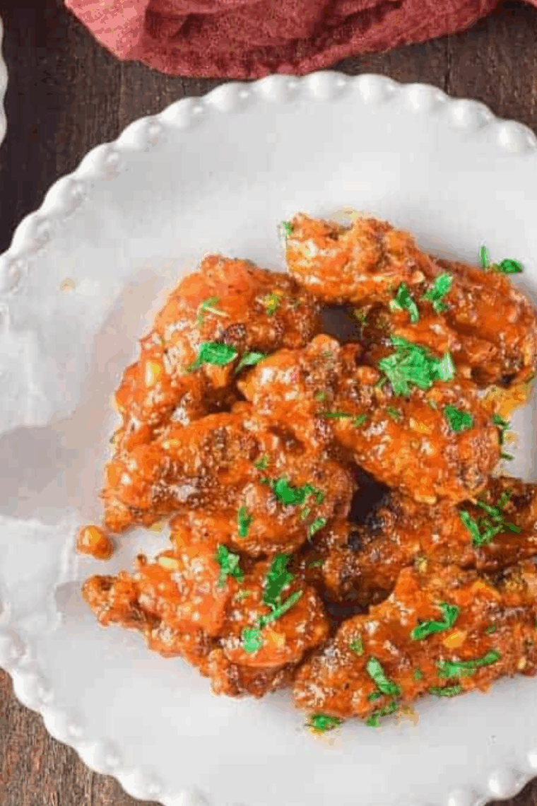 Close-up of sticky, flavorful air fryer sweet chili chicken wings ready to enjoy.