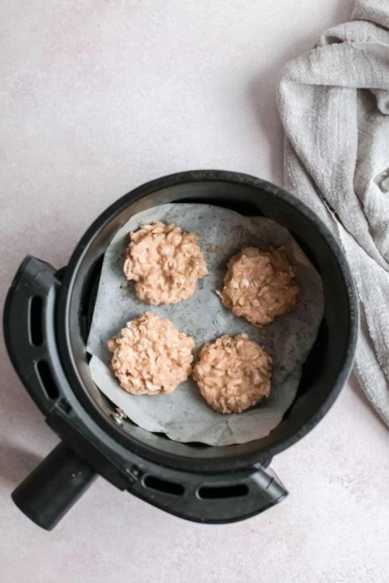 Cookies cooking in an air fryer at 350°F for 10 to 12 minutes