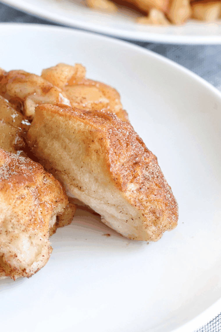 Golden, pull-apart apple cinnamon monkey bread fresh from the air fryer, drizzled with glaze.