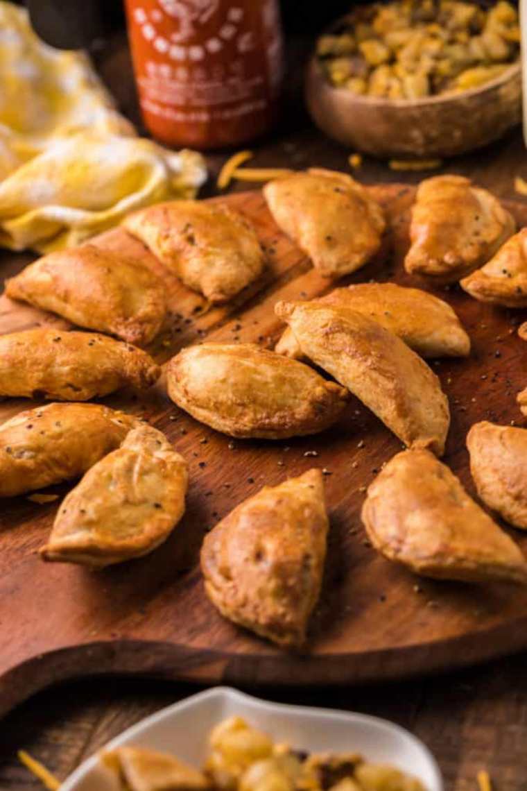 Close up of the flaky golden crust on an air fried beef empanada