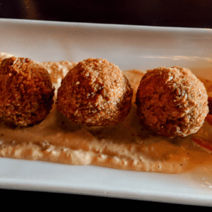 Air fryer boudin balls are a delicious and easy way to enjoy this classic Cajun dish. Made with pork, rice, and spices, boudin balls are typically deep-fried. However, air frying them gives them a crispy exterior without all the extra oil. And, since they're bite-sized, they're perfect for popping in your mouth! Best of all, they can be made ahead of time and frozen for a quick and easy snack or appetizer. Simply reheat in the air fryer when you're ready to enjoy. So next time you're in the mood for something different, give Air Fryer Boudin Balls a try - you won't be disappointed!