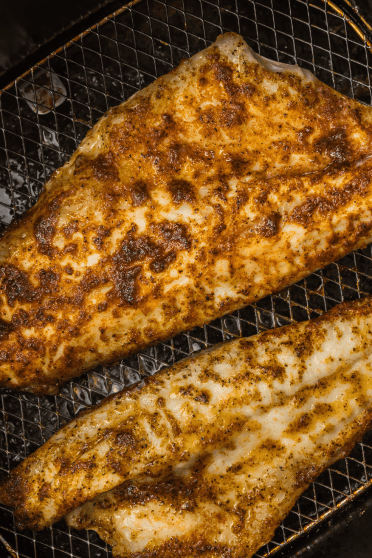 Cook: Branzino placed in air fryer basket, cooking until golden, flaky, and opaque.